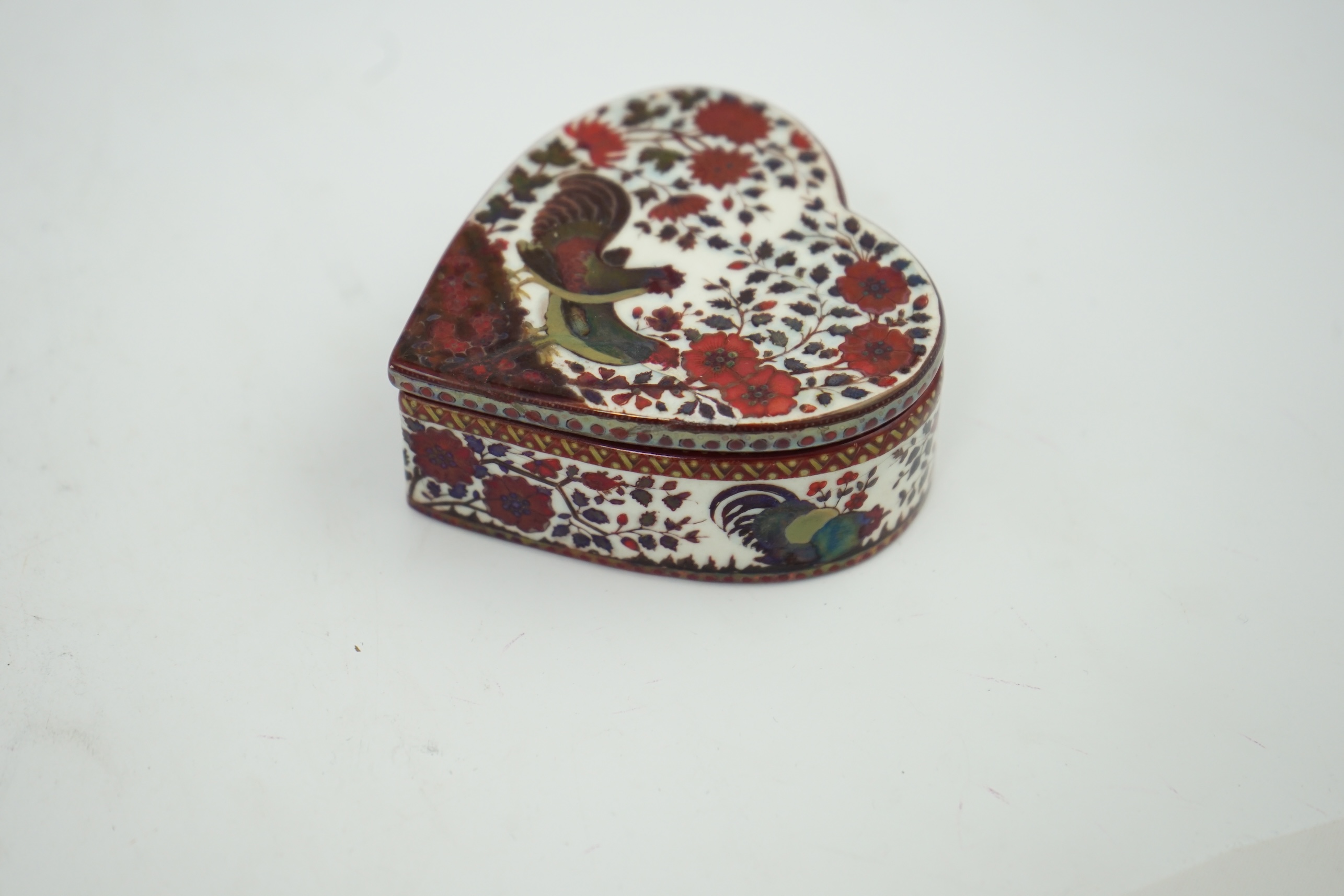 An early Zsolnay flambé lustre heart shaped box and cover, late 19th century